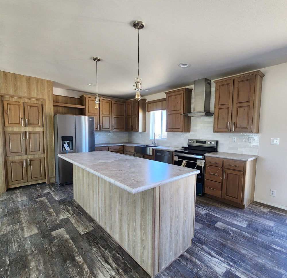 Large kitchen with huge island in the 28563N Fleetwood Sunbeam