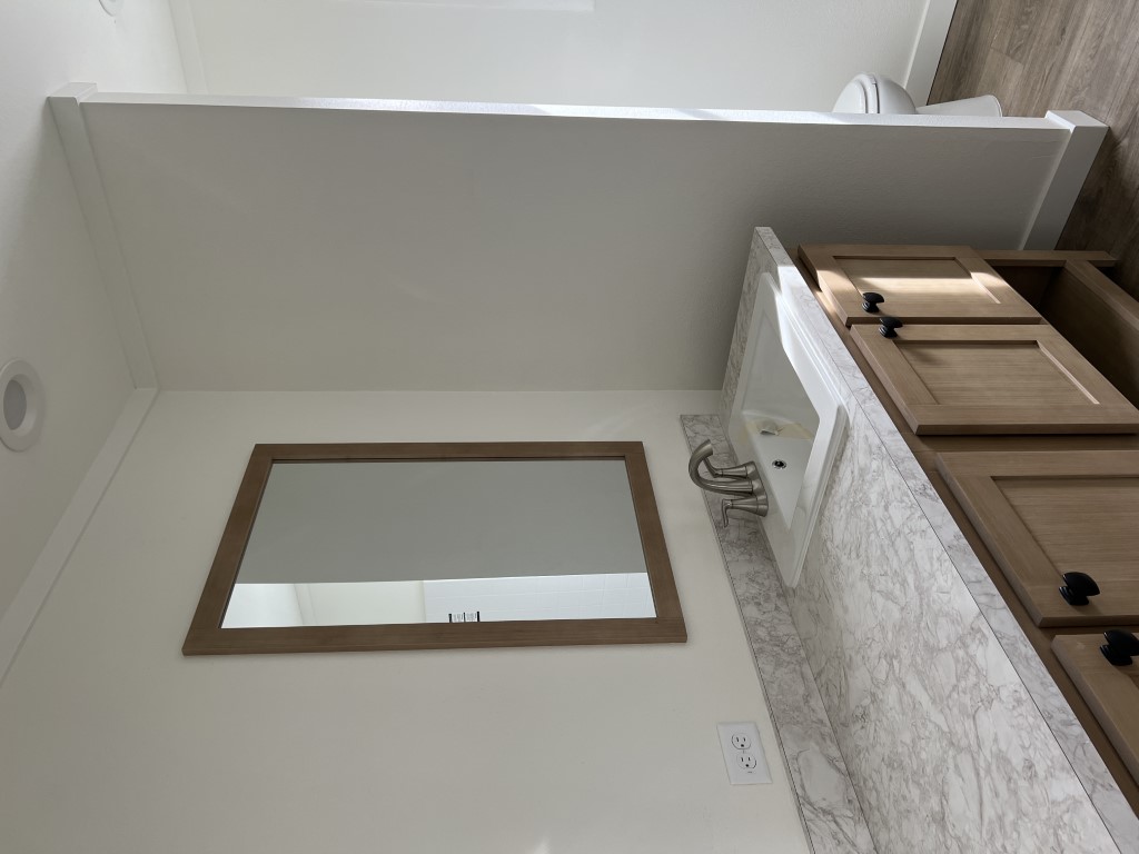 Lots of counter space in the second bathroom of this affordable home.