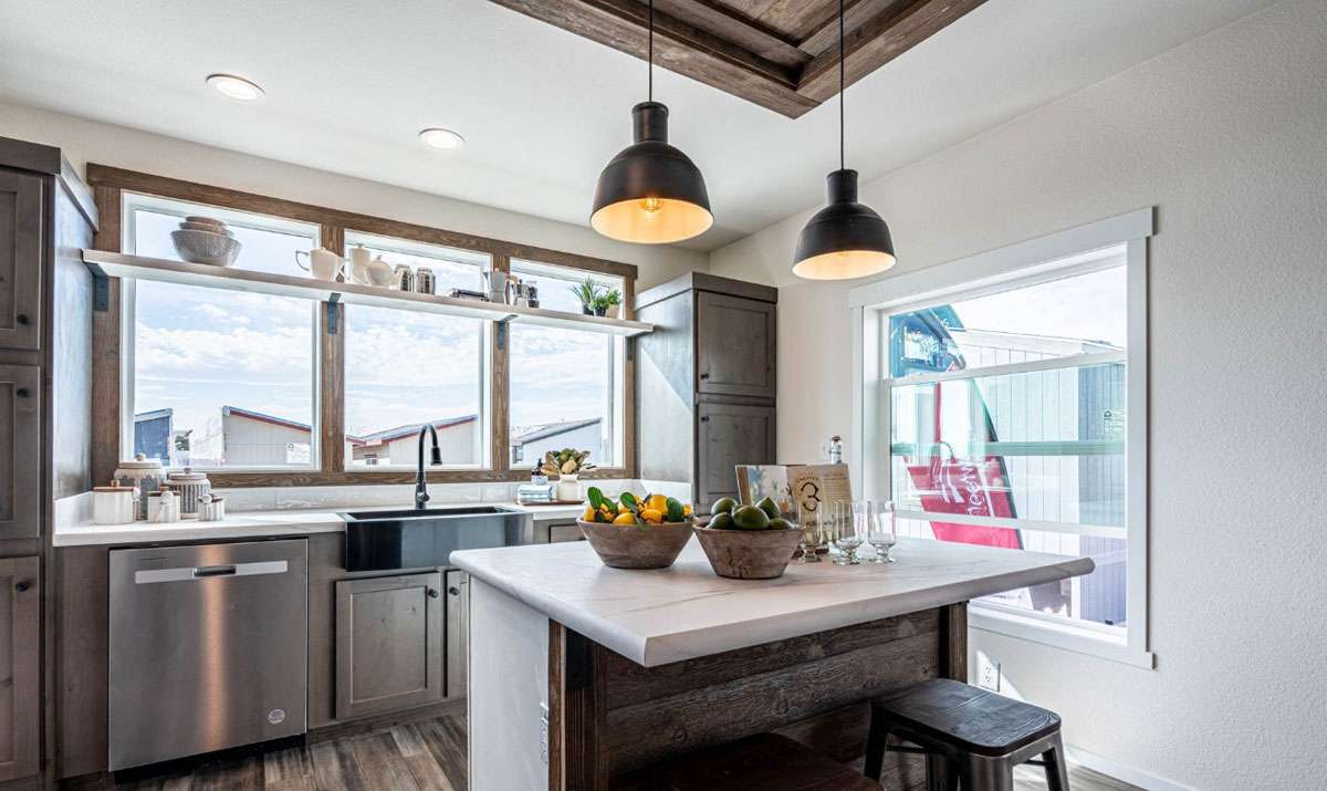 Modern kitchen with huge windows and island in The Opal by Fleetwood