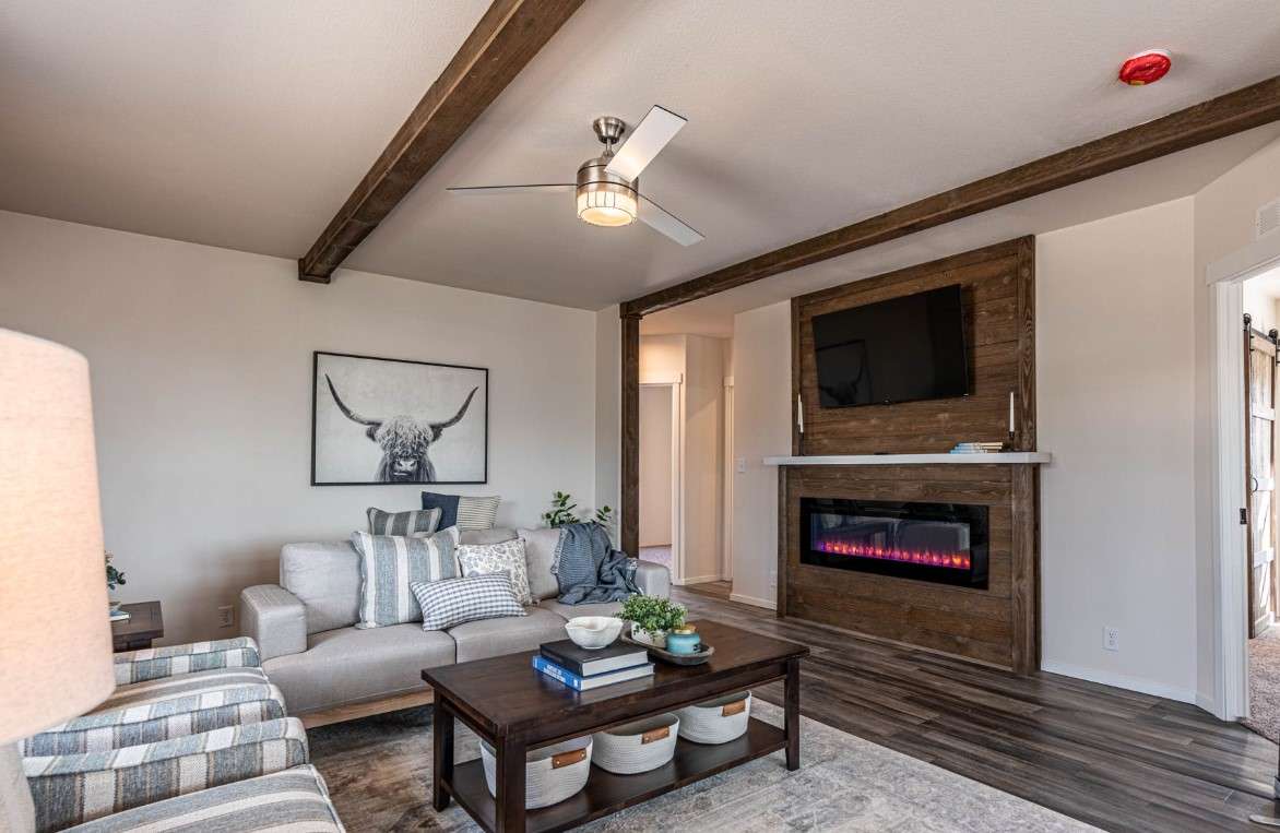 Cozy fireplace included in The Opal 28483F by Fleetwood Homes.