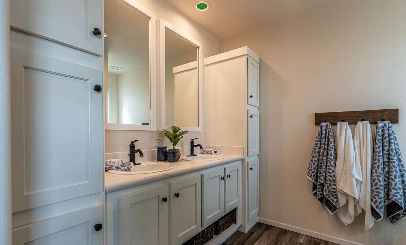 Ample storage and farmhouse charm in The Opal master bathroom.