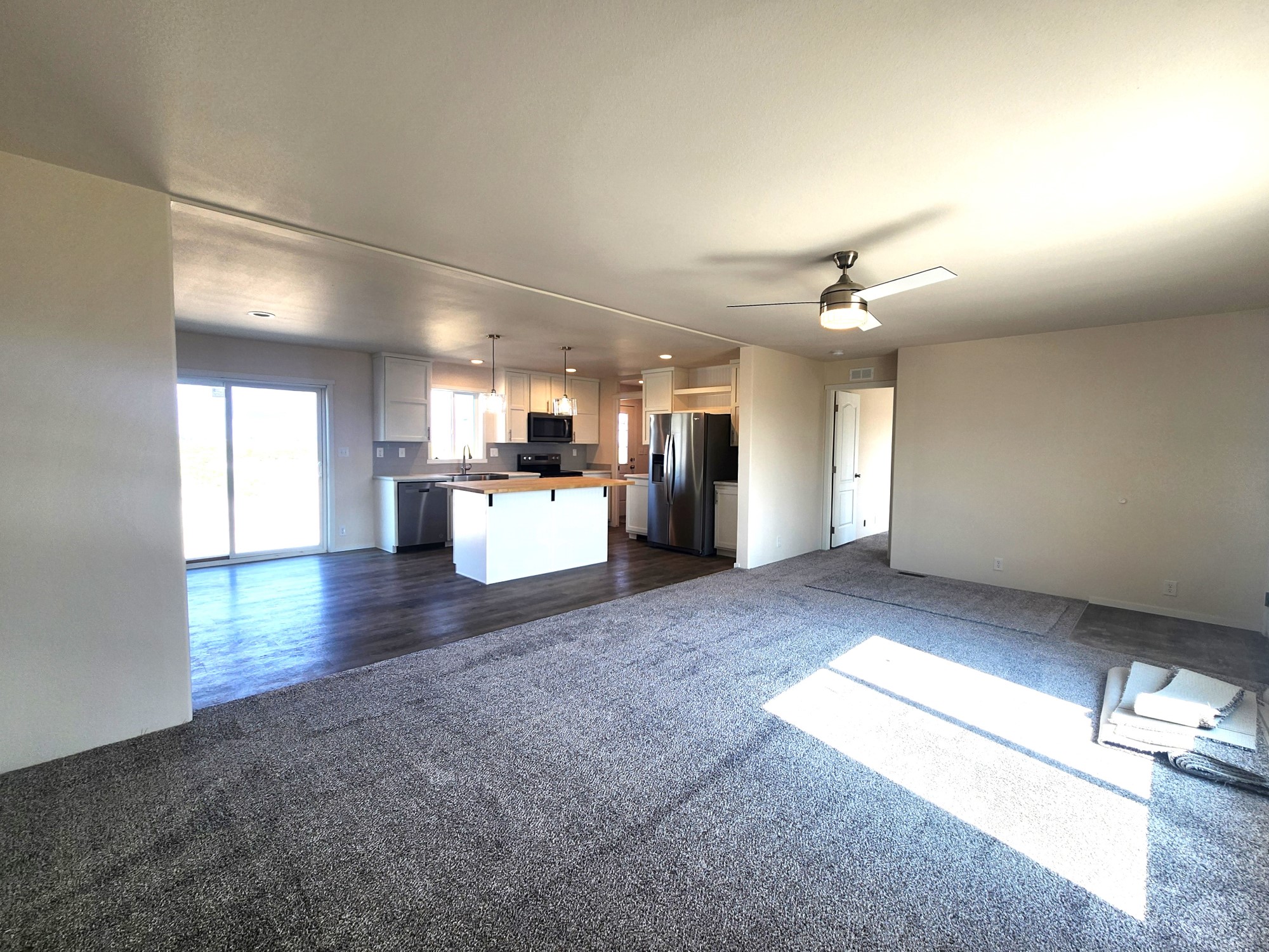 Huge open living room connected to the kitchen in the Broadmore 28683B