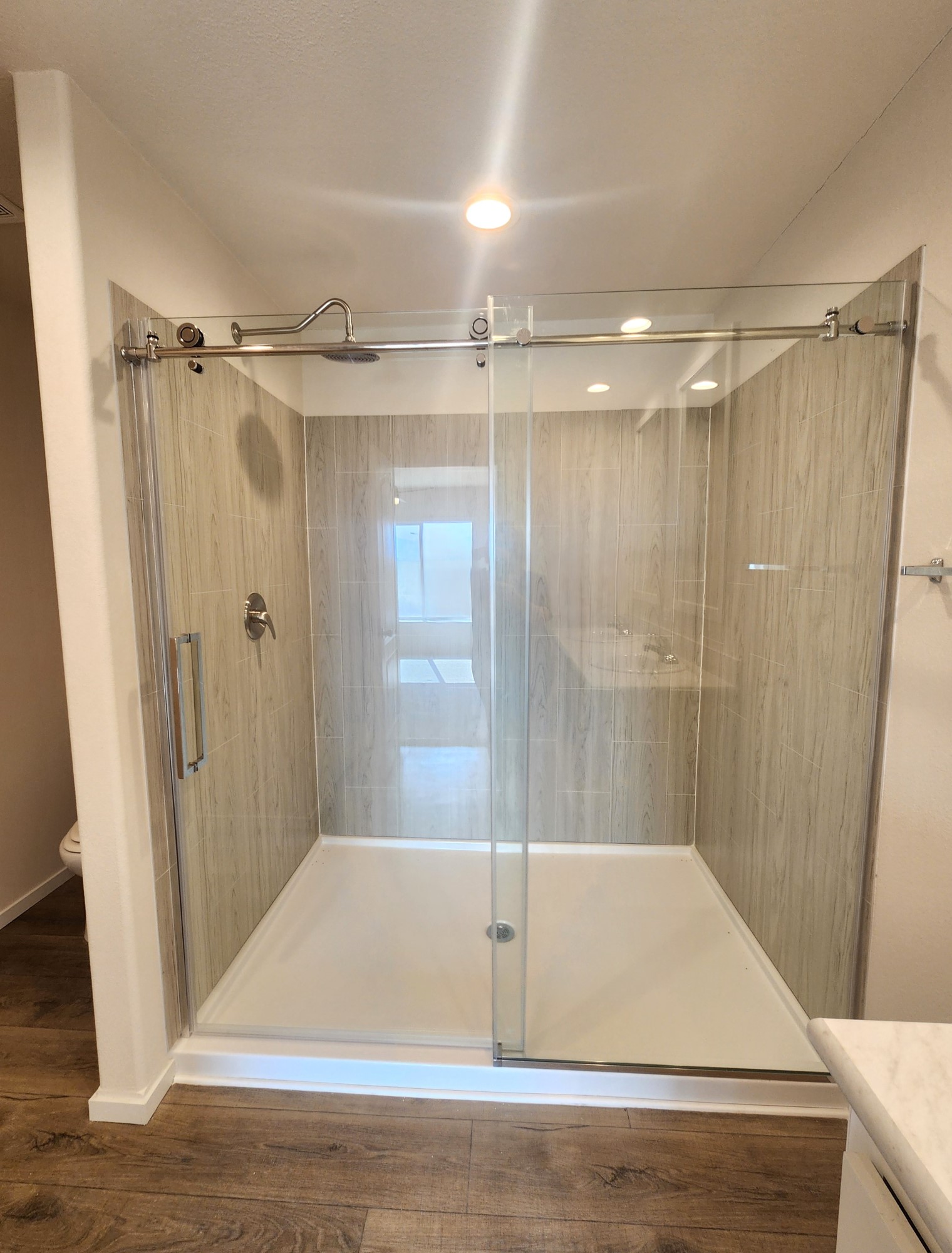 Large walk-in shower in this Cavco Broadmore 28683B manufactured home